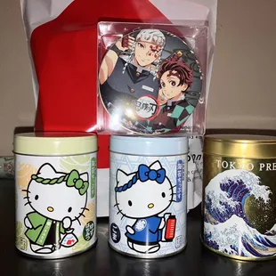 Demon Slayer Wafers, green HK (Yuzu Honey Seaweed chips), blue HK (Sesame seaweed chips), and the golden tin (Wasabi seaweed chips)
