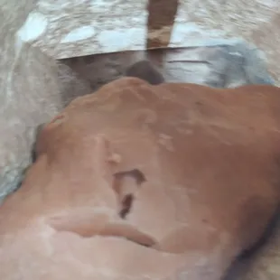 a piece of bread in a paper bag