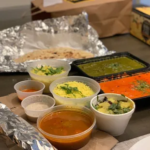 Butter chicken, saag paneer, Naan, dosa, and rice