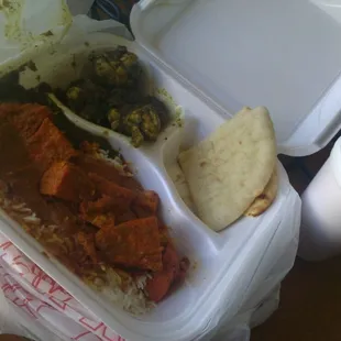 Chicken tikka masala on white rice, bone-in chicken (spicy but delicious - forgot what it&apos;s called), naan and mango lassi