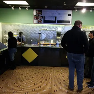 a group of people in a fast food restaurant