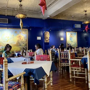 a dining room with blue walls