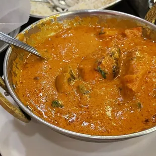 a bowl of curry and a plate of rice