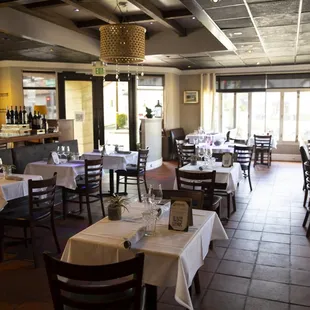 a dining room with tables and chairs