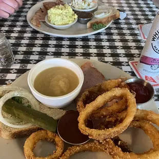a plate of food with onion rings