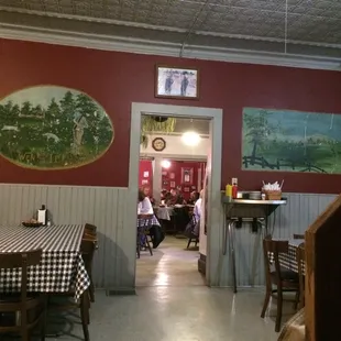 a dining room with tables and chairs