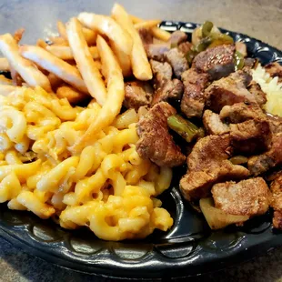 Souvlaki Tips with Peppers &amp; Onions over Rice, French Fries &amp; Macaroni n&apos; Cheese. So, so good!