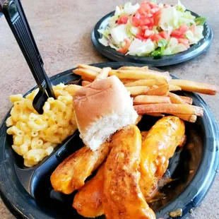 Grilled Buffalo Chicken Tenders with Macaroni n&apos; Cheese, French Fries, Dinner Roll and side Tossed Salad.
