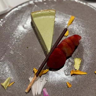 The green tea cheesecake with sliced strawberries