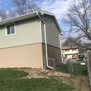 a house with siding and gutters
