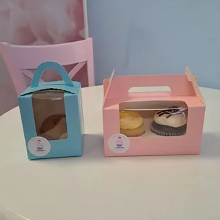 two cupcakes in a box