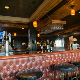  bar with stools and a television