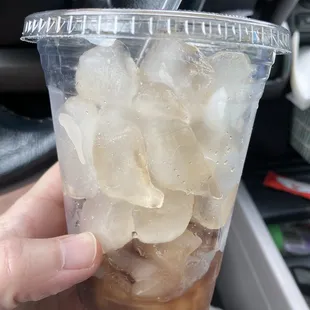 Cup of ice with a little coke