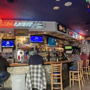 people sitting at the bar