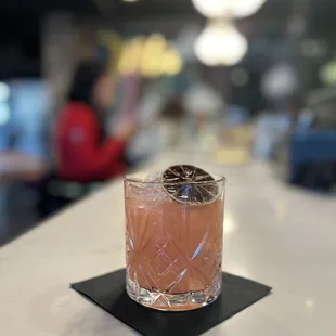 a pink drink in a glass