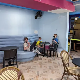 a group of children sitting at a table