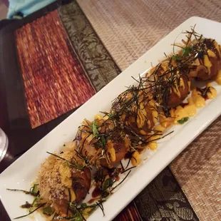 Takoyako. Deep fried dough balls with octopus bits. Yummy a must order. Devoured by the table quickly.