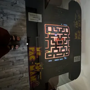 a man standing in front of a video game