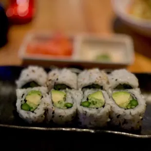 a plate of sushi rolls