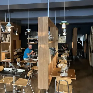 a man sitting at a table in a restaurant