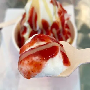 Sunrise sundae with pineapple soft serve, strawberry li hing sauce, and coconut condensed milk drizzle.