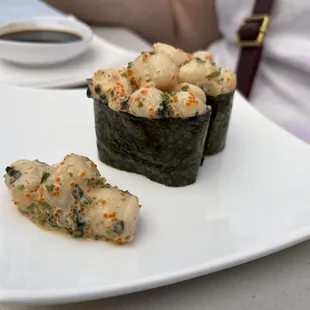 a close up of a plate of sushi