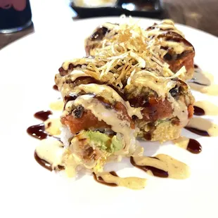 "Duck" roll? A crab avocado, spicy tuna extravaganza with eel sauce roll topped with tempura -like no other!