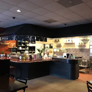 the inside of a restaurant with tables and chairs