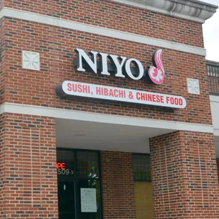 the front of a restaurant with a sign that says sushi hibachi and chinese food