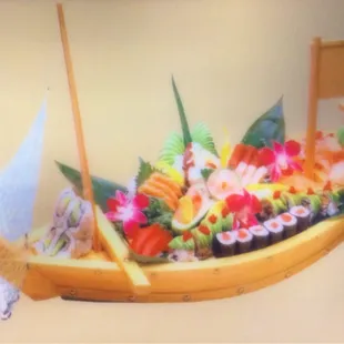 a model of a boat with sushi on it