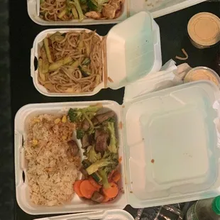four take out containers of food