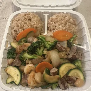 Steak, shrimp, and scallop plate with fried rice