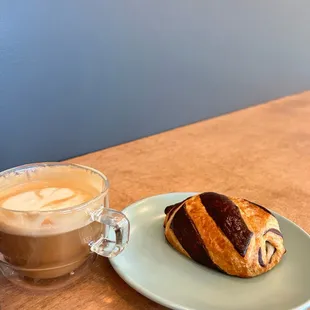 a pastry and a cup of coffee