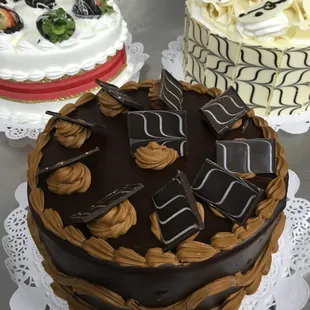 three cakes on a table