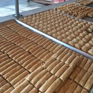 a variety of pastries on a conveyor belt