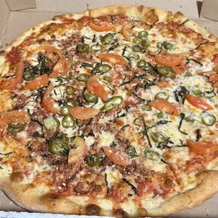 X-Large Margherita Pizza with added bacon and jalapeños.