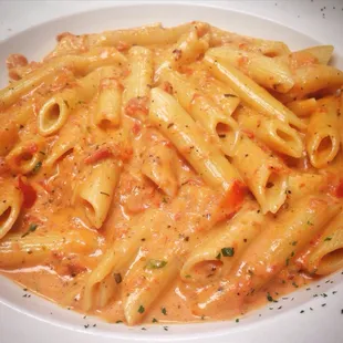 Homemade Penne al Vodka, cooked in a from-scratch, made-to-order creamy tomato-basil sauce, with a splash of Vodka to kick it up a notch!