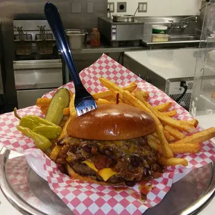 a chili cheeseburger and french fries