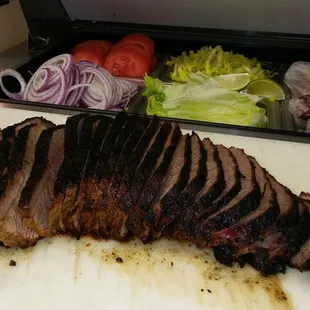 sliced meat on a cutting board