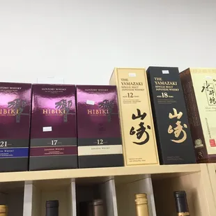 a shelf full of liquor bottles