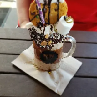 a cup of hot chocolate with marshmallows and marshmallows