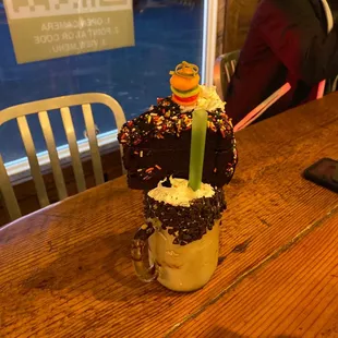Enormous milk shake with cake ontop