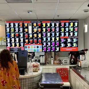 a woman standing in front of the counter