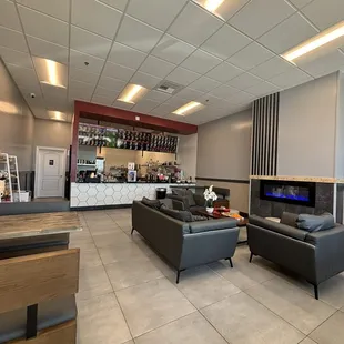 Clean sitting area with fireplace and boardgames!