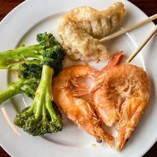shrimp, broccoli, and rice on a white plate