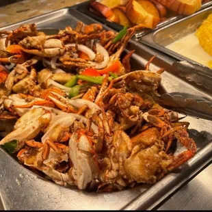 crab legs, corn, and corn on the cob
