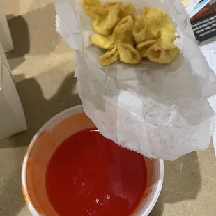 Cream Cheese Wontons with Sweet and Sour Sauce.