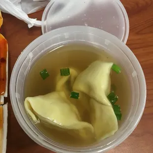 a bowl of soup and a sandwich