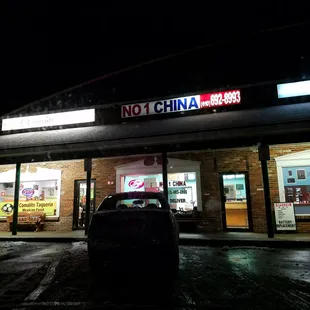 a car parked in front of a restaurant