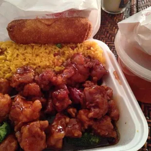 a takeout container of chicken, rice, and broccoli